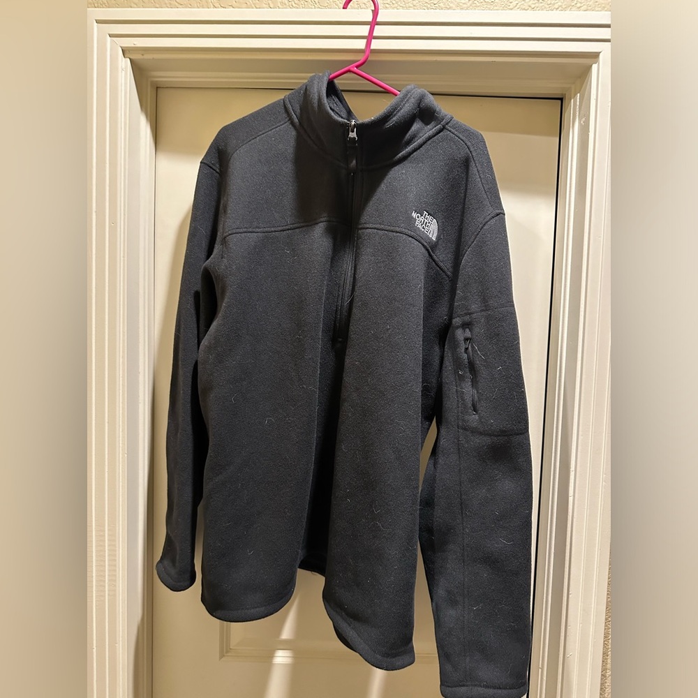 Black Winter sweater, pocket on the sleeve and zipper down the front.